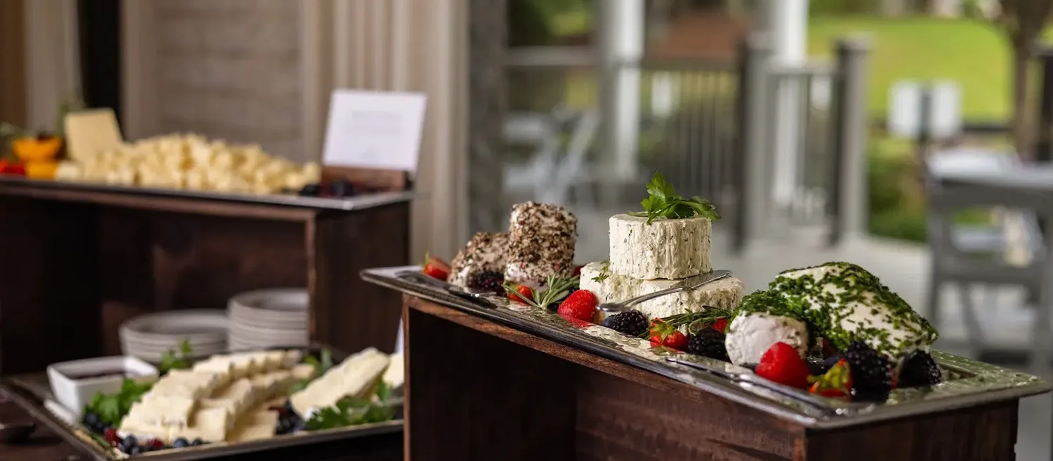 a variety of deserts are presented on luxurious cabinetry inside Castleton's banquet hall