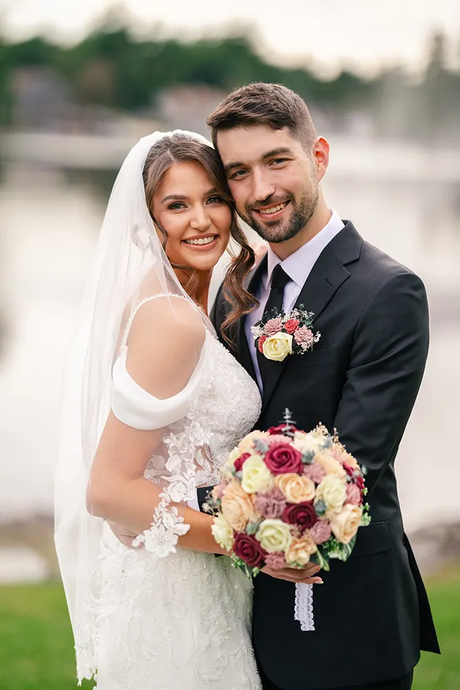 Erica & Austin pose for the camera in their wedding attire